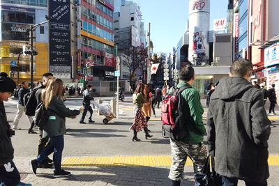 People walking on street in city