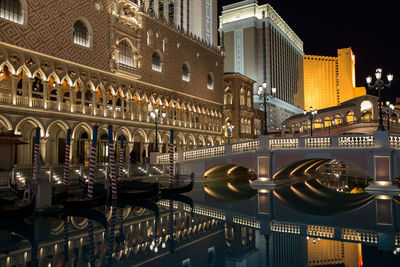 View of illuminated buildings in city at night