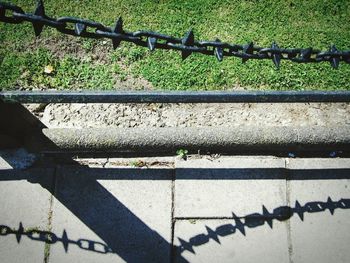 High angle view of fence by railing