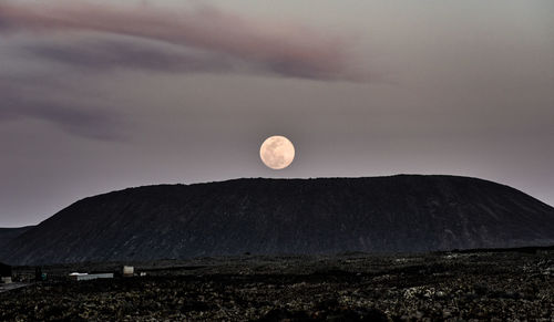 Scenic view of moon against sky at night