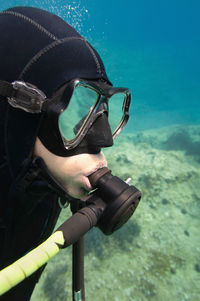 Woman scuba diving in sea