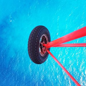 High angle view of wheel by swimming pool