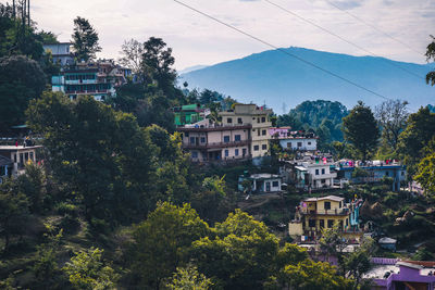 High angle view of townscape and trees against sky