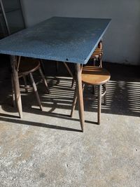 High angle view of empty chairs and table