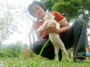 Full length of mother and daughter on grass