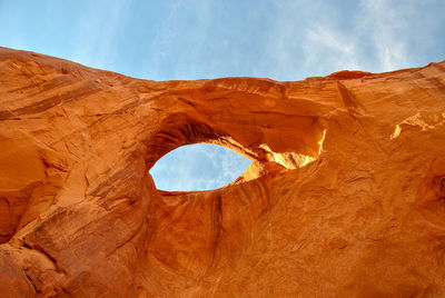 Low angle view of rock formation against sky