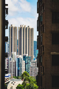 Modern buildings in city against sky