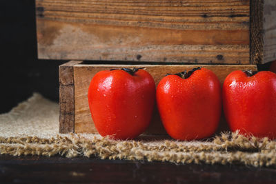 Close-up of persimmons side by sidei