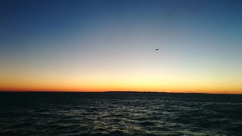 Scenic view of sea at sunset