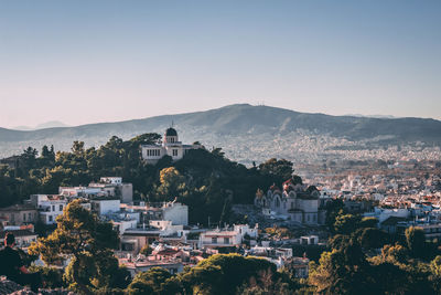 Scenic view of residential district against sky 