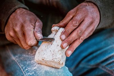 Close-up of man working on wood