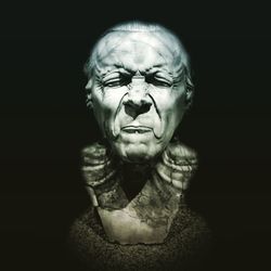 Portrait of man wearing mask against black background