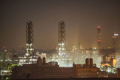 Illuminated buildings in city at night