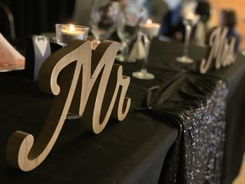 Close-up of wine glasses on table