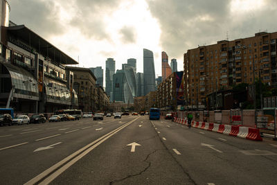 City street amidst buildings against sky