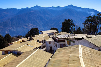 High angle view of houses and trees against sky