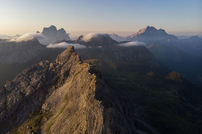 Scenic view of snowcapped mountains against sky during sunset