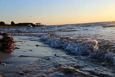 Scenic view of sea against clear sky during sunset