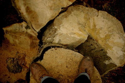 Low section of woman standing on rocks