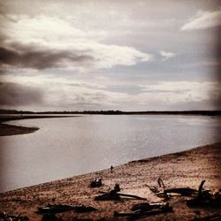 Scenic view of sea against cloudy sky