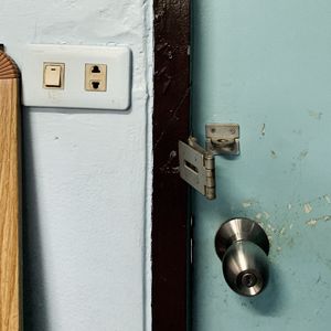 Close-up of electric lamp on door