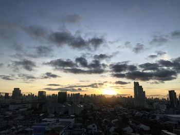 High angle view of buildings against sky during sunset