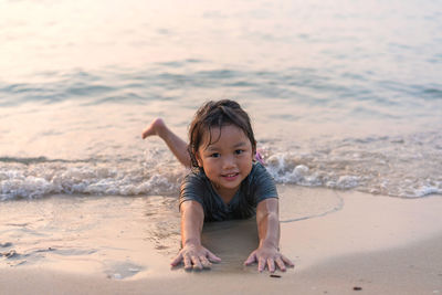 Portrait of boy playing at beach