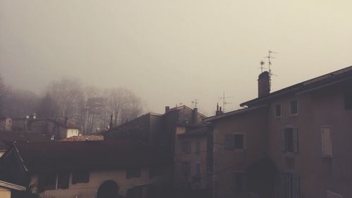 Buildings in city against sky