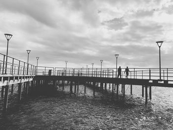 Pier over sea against sky