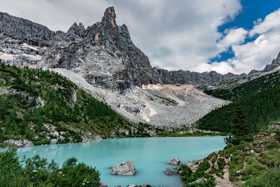 Scenic view of lake and mountains against sky