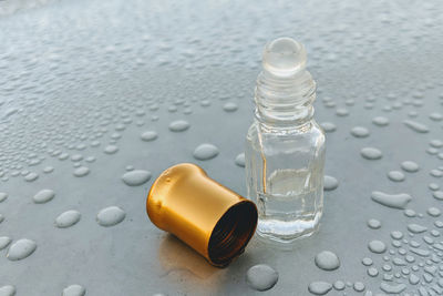 Close-up of wet glass bottle