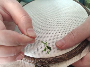 A woman doing rhinoceros needle thread embroidery