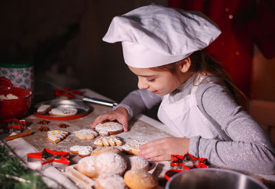Young woman preparing food at restaurant