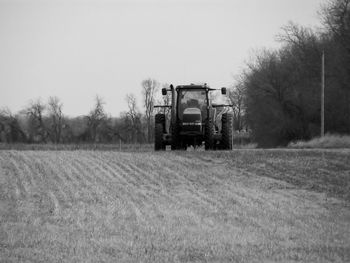 View of agricultural field against clear sky