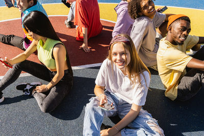 High angle view of friends standing on street