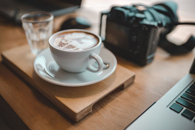 Close-up of coffee cup on table