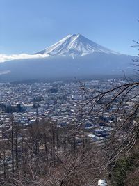 High angle view of snowcapped mountain against sky