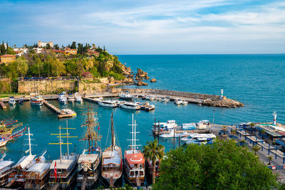 High angle view of boats in sea against sky