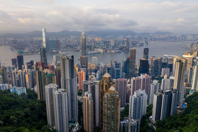 Aerial view of modern buildings in city against sky