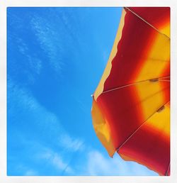 Low angle view of umbrella against sky