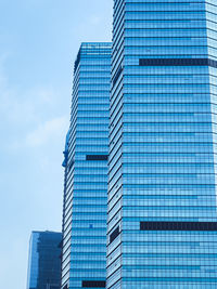 Low angle view of skyscraper against sky