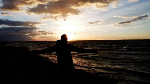 Silhouette of people on beach