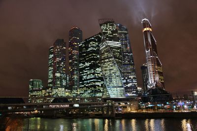 Low angle view of illuminated buildings at night