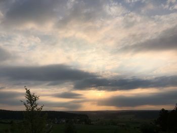 Scenic view of landscape against sky during sunset