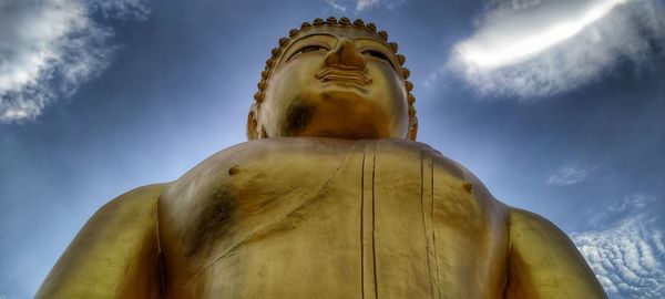 Low angle view of statue against sky