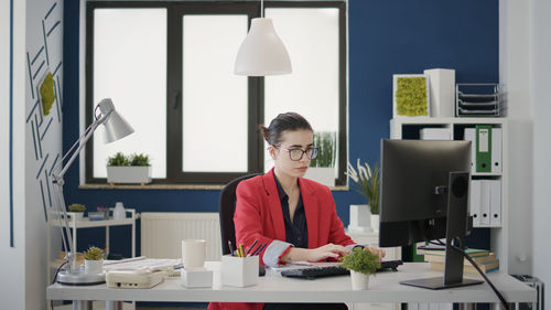 Businesswoman working on computer in office