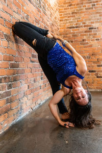 Full length of woman on wall