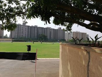 Gazebo in park against sky in city