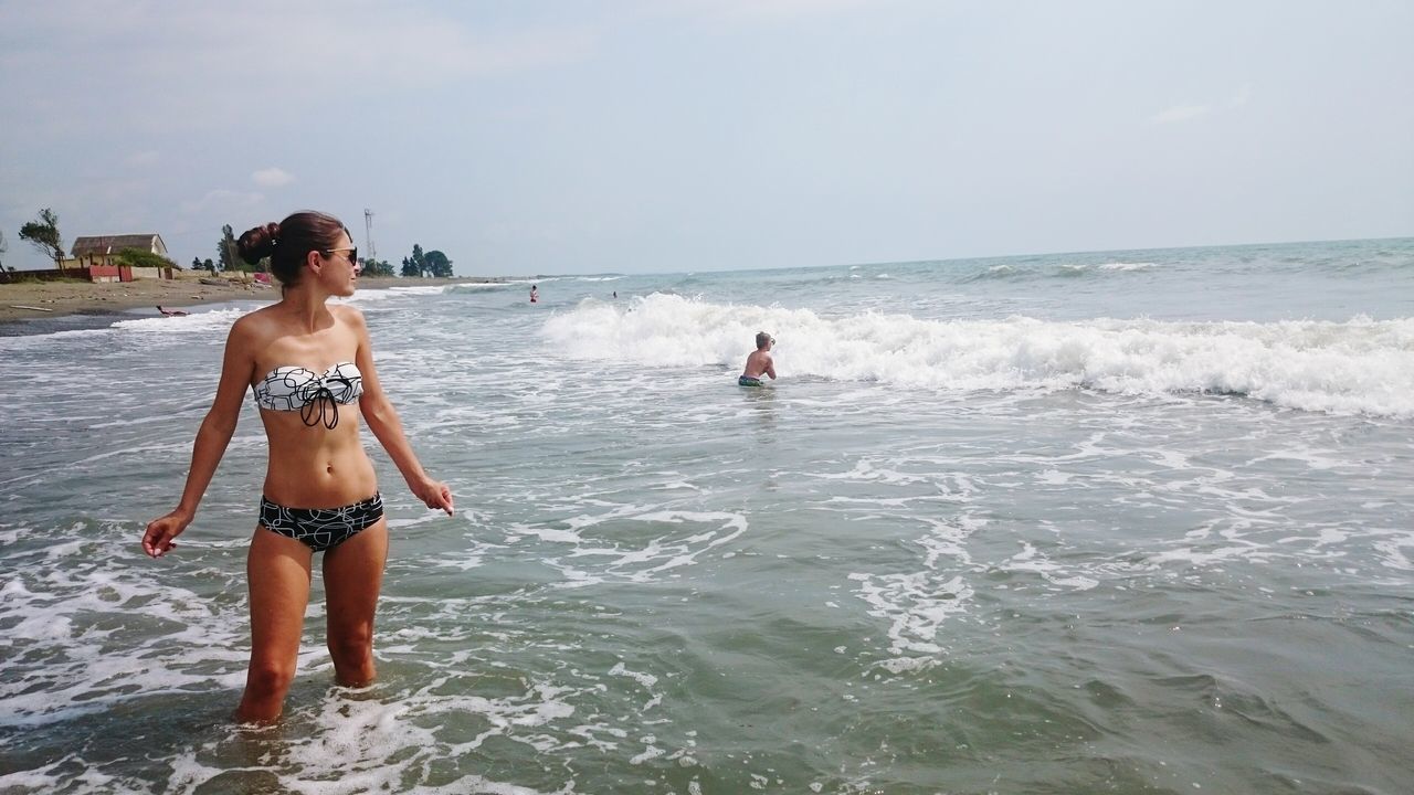 water, sea, horizon over water, leisure activity, lifestyles, wave, beach, waterfront, vacations, enjoyment, shirtless, clear sky, full length, fun, nature, shore, copy space