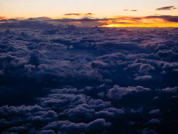 Aerial view of clouds over sea during sunset